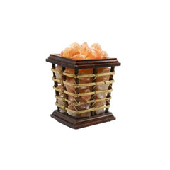 Square wood-and-cane basket lamp filled with glowing pink Himalayan salt chunks