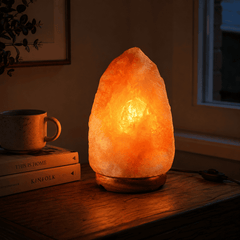 Himalayan Salt Lamp (5-7kg) – styled in a home lifestyle setting, lit at evening