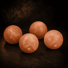 Himalayan Salt Massage Balls (Set of 4) – studio photo lit against a dark background