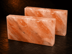 Natural Himalayan Salt Tiles (Pack of 2) – studio photo lit against a dark background