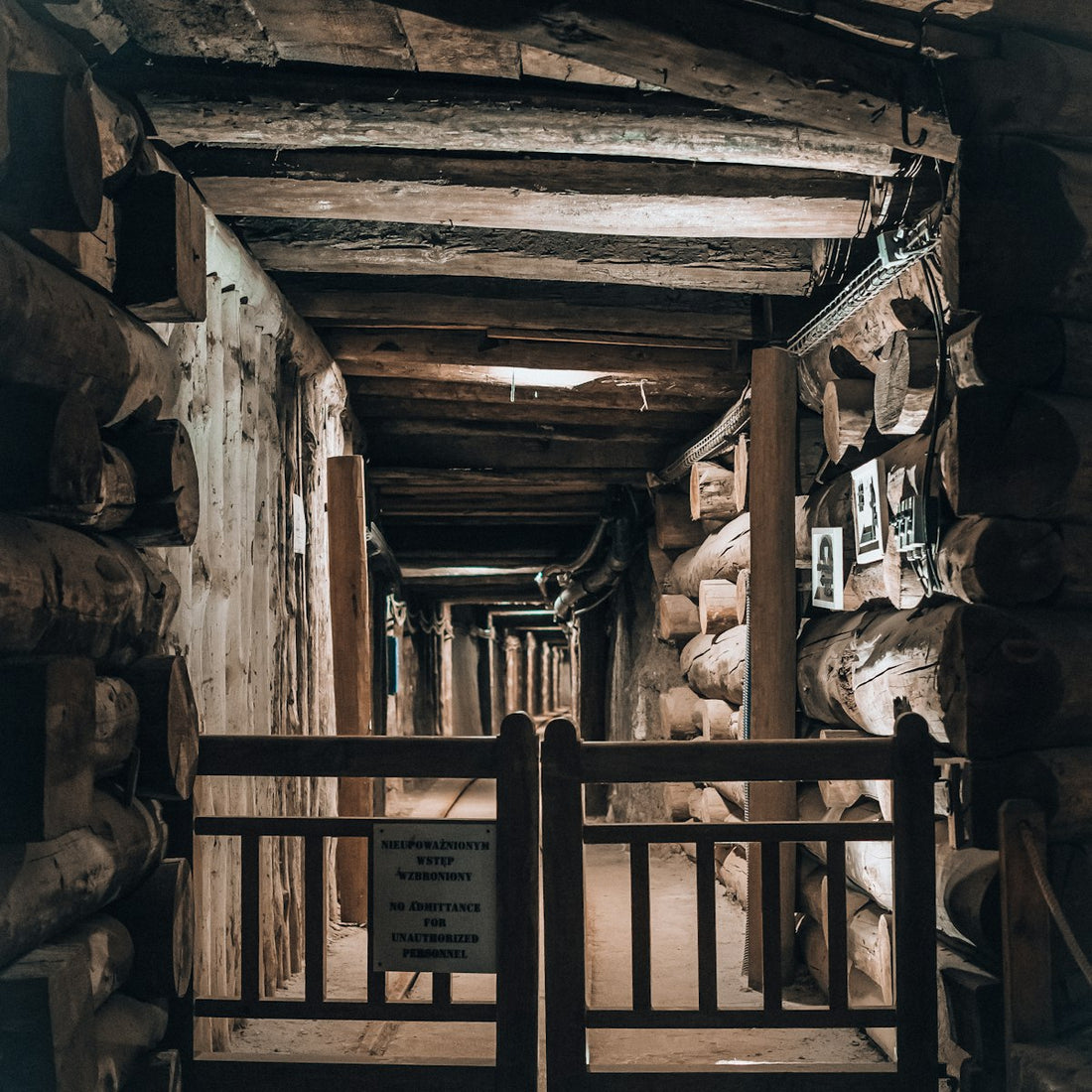 Wooden walkway inside an underground salt mine, tracing where hand-carved salt lamps begin