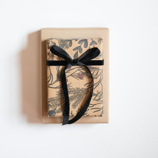 Black-ribboned gift box, similar to how a Himalayan salt lamp gift set is packaged