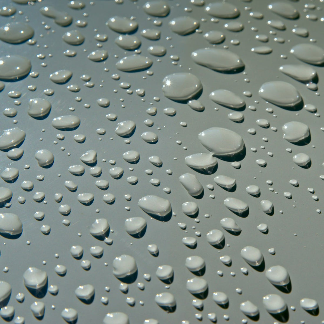 Close-up of water droplets on a surface, similar to moisture causing a salt lamp to sweat