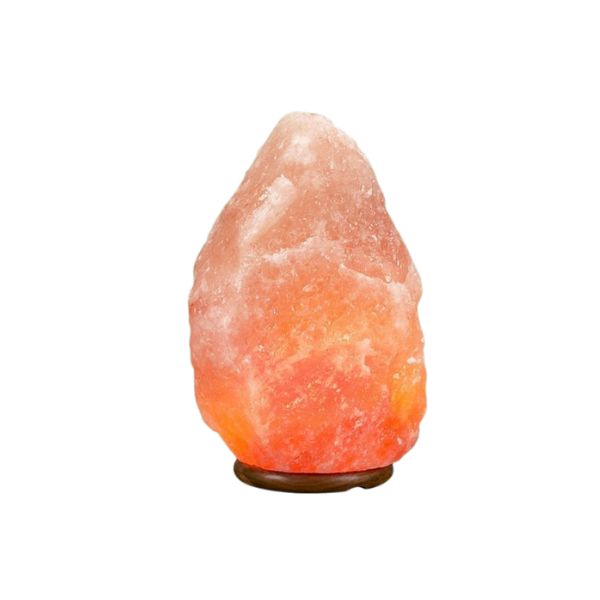 Large natural Himalayan salt lamp glowing amber on a wooden base against a white background