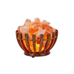 Wood-slat bowl salt lamp filled with glowing pink Himalayan salt chunks on a white background