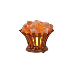 Flower-shaped wood-slat basket lamp filled with glowing Himalayan salt chunks against a white background