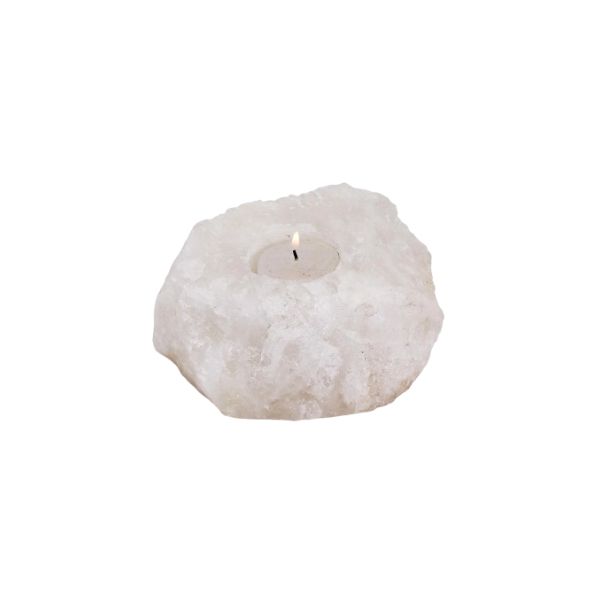 White Himalayan salt crystal candle holder with a lit tealight candle on a white background