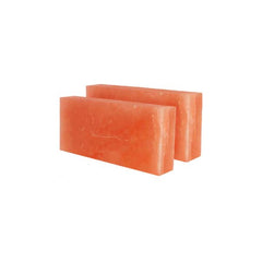 Two rectangular Himalayan salt bricks on a white background