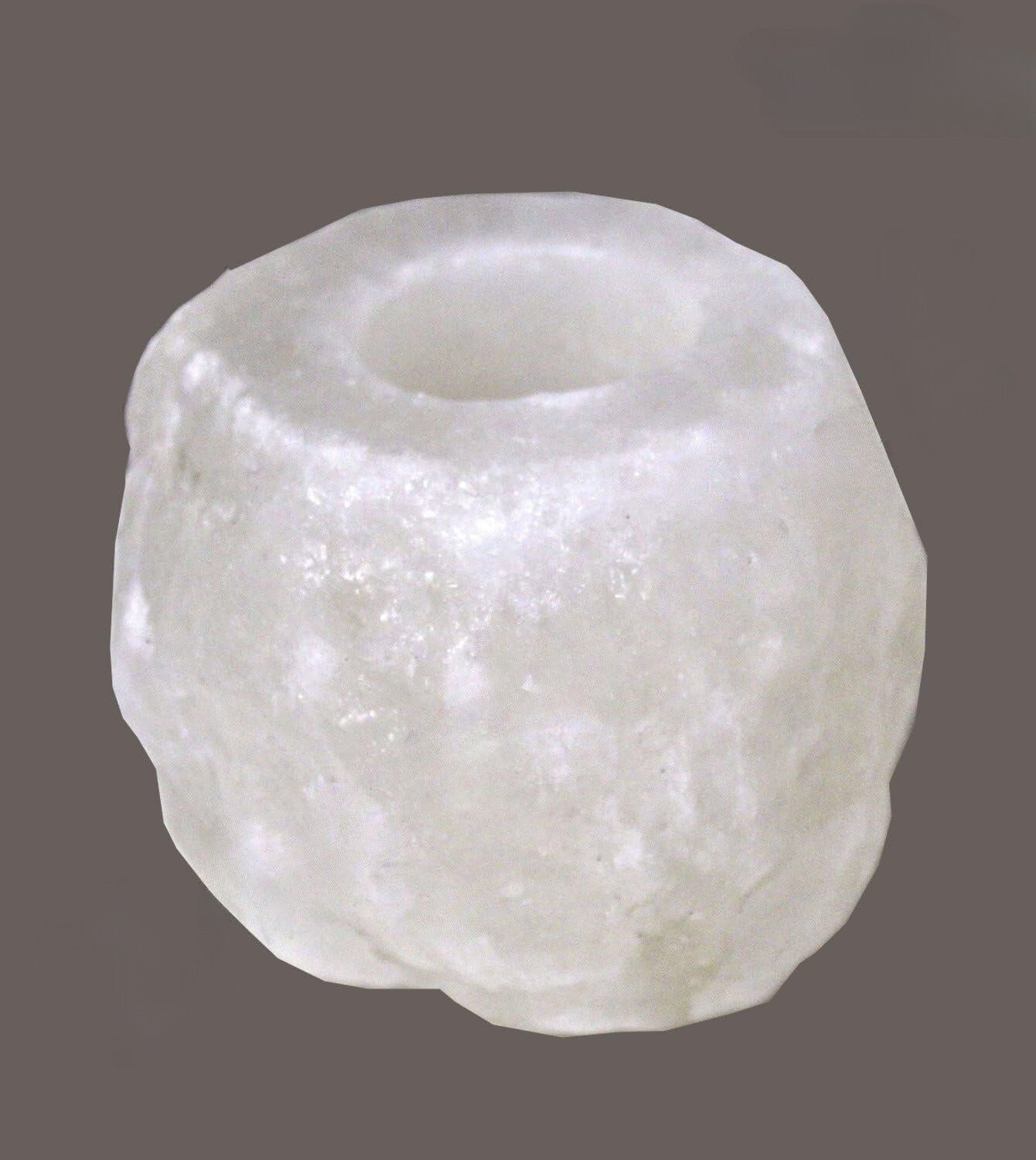 White Himalayan salt crystal candle holder viewed from above with an empty tealight well