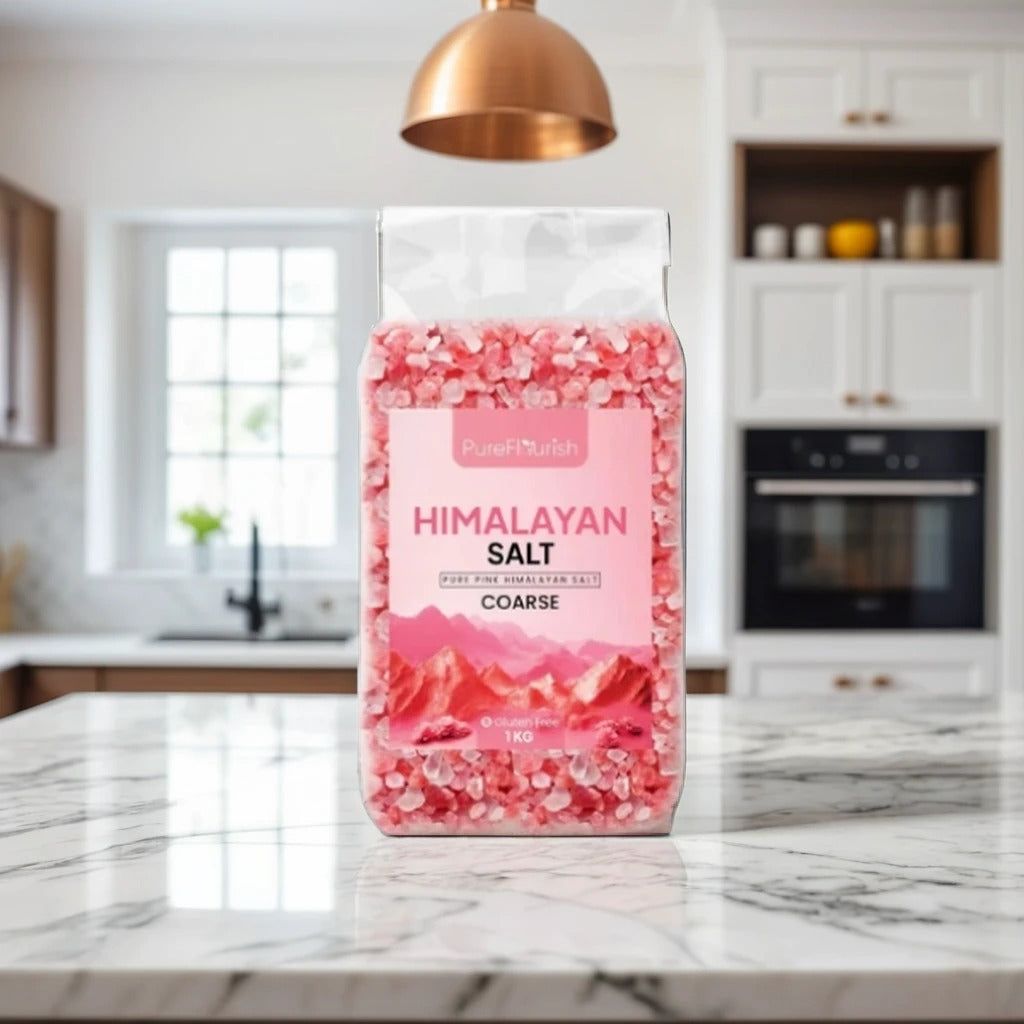 1kg bag of coarse Himalayan pink salt standing on a marble kitchen counter