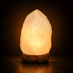 Crystal Himalayan Salt Lamp (3-5kg) – studio photo lit against a dark background