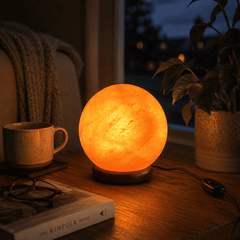 Large Himalayan Salt Ball Lamp (4kg) – styled in a home lifestyle setting, lit at evening