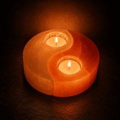 Yin Yang Himalayan Salt Candle Holder – studio photo lit against a dark background