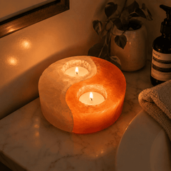 Yin Yang Himalayan Salt Candle Holder – styled in a home lifestyle setting, lit at evening