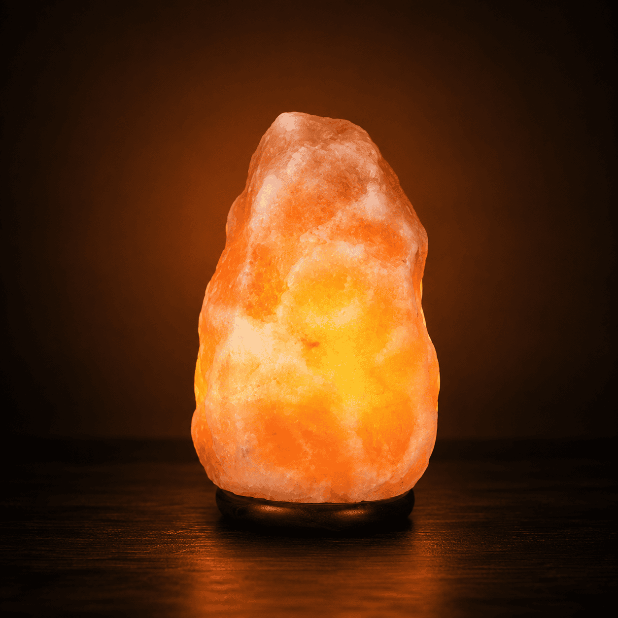 Himalayan Salt Lamp (2-3kg) – studio photo lit against a dark background