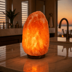Himalayan Salt Lamp (7-9kg) – styled in a home lifestyle setting, lit at evening
