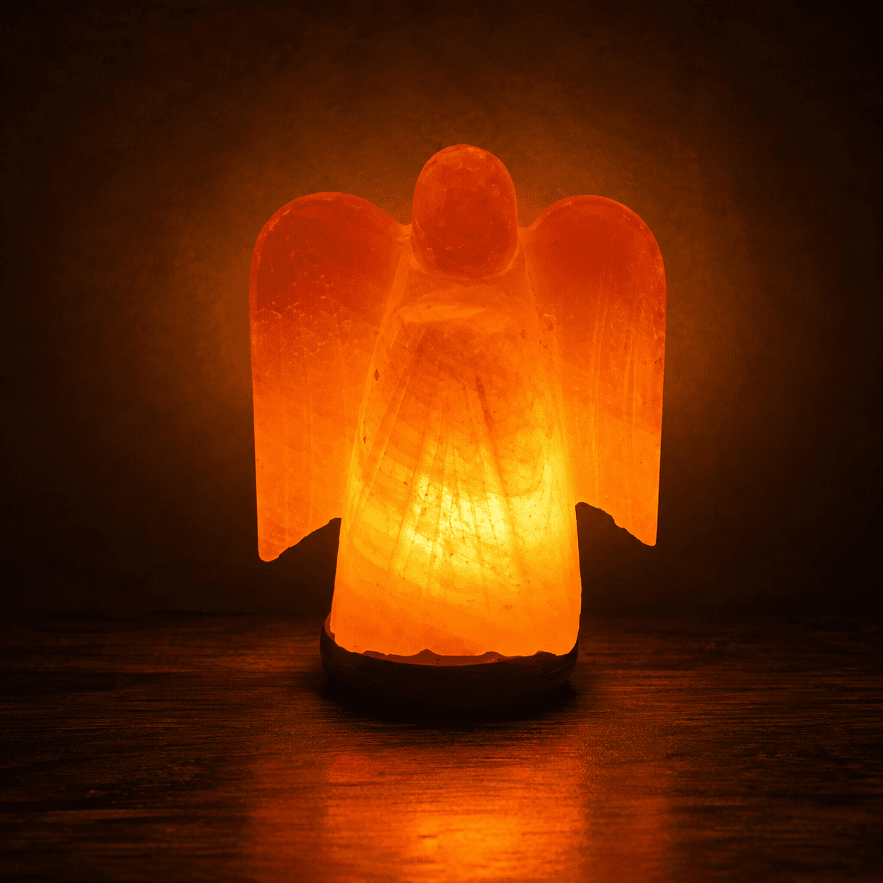 Angel Shape Himalayan Salt Lamp – studio photo lit against a dark background