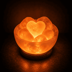 Fire Bowl Himalayan Salt Lamp with 6 Heart Stones – studio photo lit against a dark background