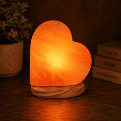 Heart Shape Himalayan Salt Lamp – studio photo lit against a dark background