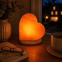 Heart Shape Himalayan Salt Lamp – styled in a home lifestyle setting, lit at evening